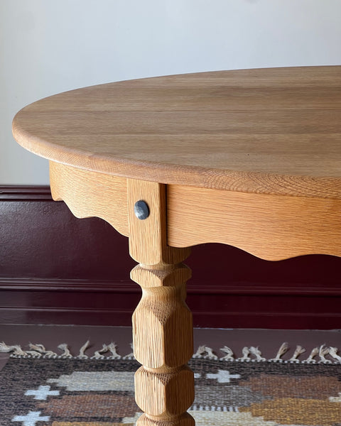 Vintage round wooden dining table with wavy/scalloped details