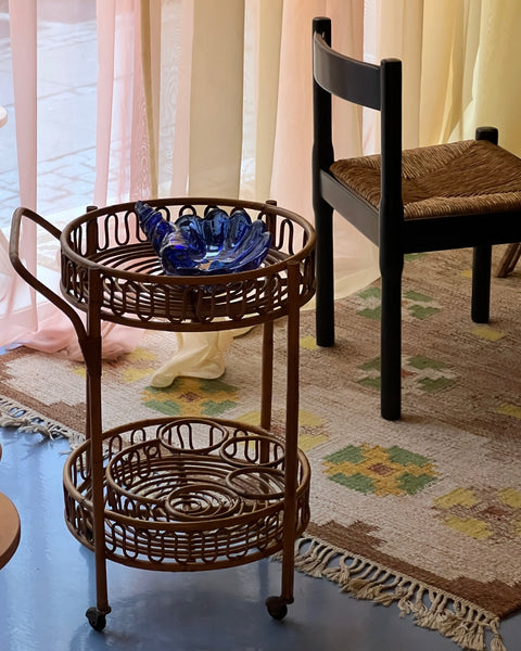 Vintage rattan table with wheels