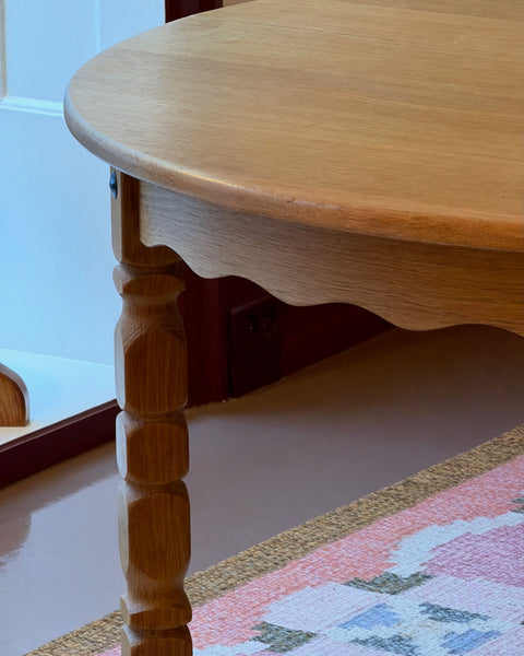 Vintage round wooden dining table with wavy/scalloped details
