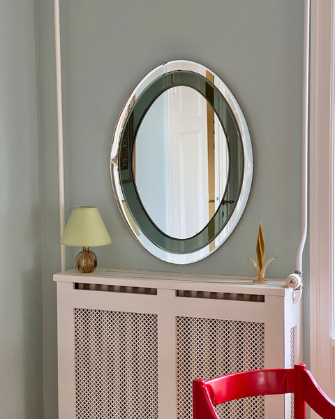 Vintage oval Italian mirror with green and facetted mirror frame