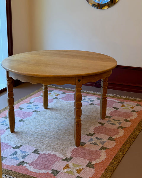Vintage round wooden dining table with wavy/scalloped details