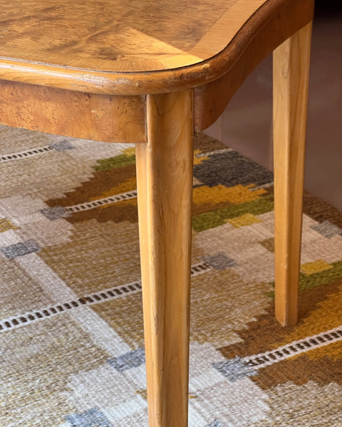 Vintage wooden coffee table with burl details
