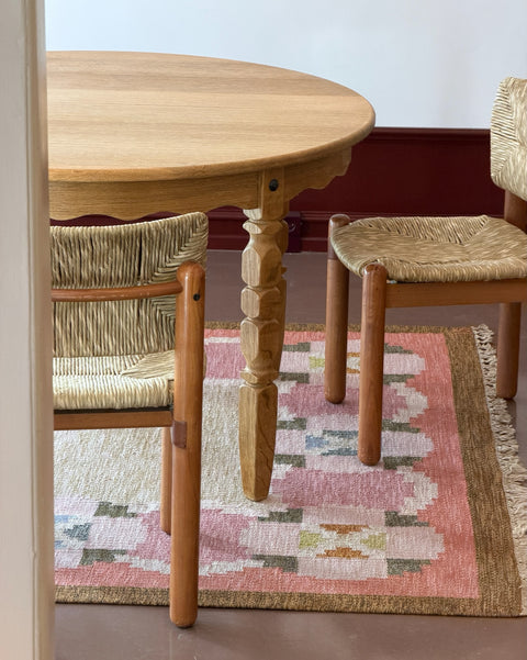Vintage round wooden dining table with wavy/scalloped details