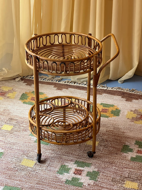 Vintage rattan table with wheels