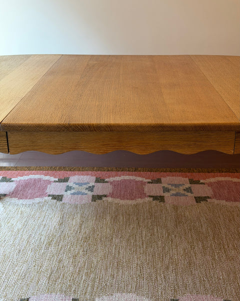 Vintage round wooden dining table with wavy/scalloped details