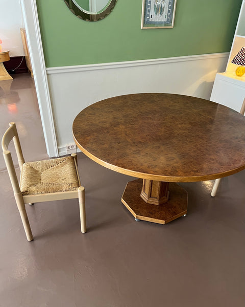 Vintage round wooden dining table with burl details