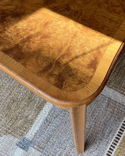 Vintage wooden coffee table with burl details