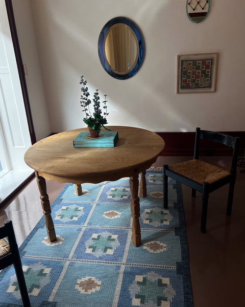 Vintage round wooden dining table with wavy/scalloped details
