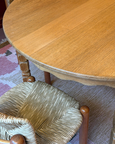 Vintage round wooden dining table with wavy/scalloped details