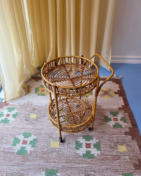 Vintage rattan table with wheels