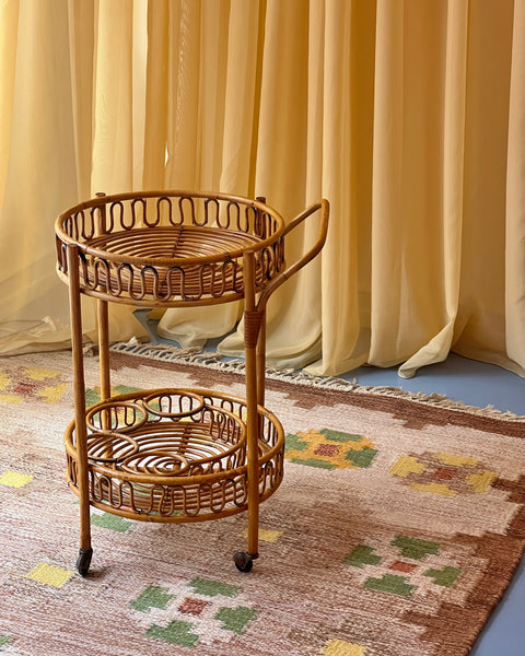 Vintage rattan table with wheels