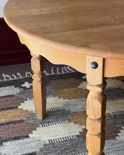 Vintage round wooden dining table with wavy/scalloped details