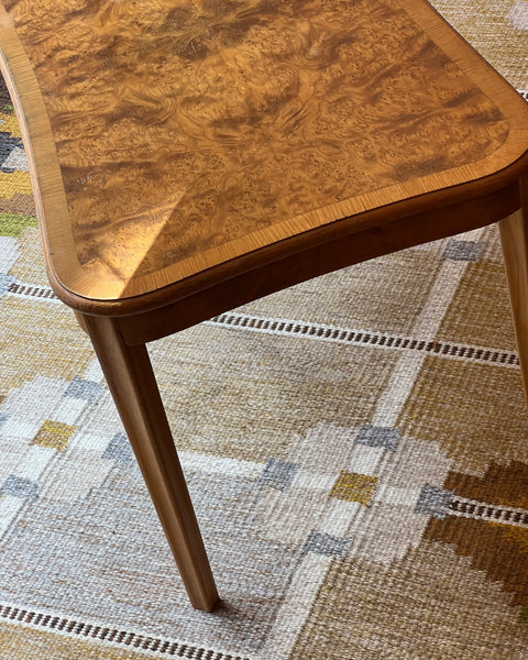 Vintage wooden coffee table with burl details