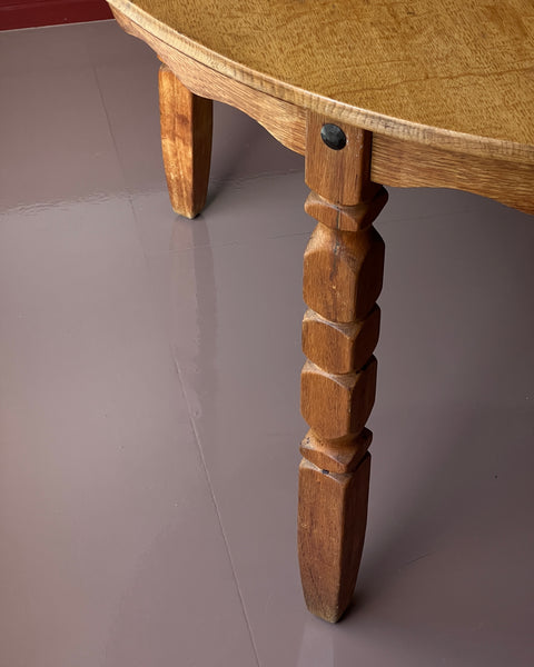Vintage round wooden dining table with wavy/scalloped details