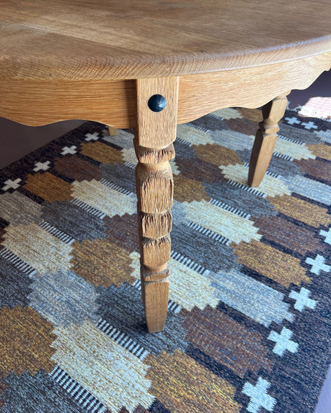Vintage round wooden dining table with wavy/scalloped details