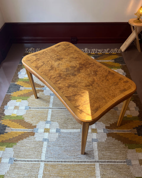 Vintage wooden coffee table with burl details