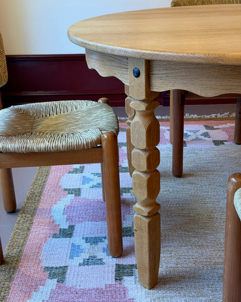 Vintage round wooden dining table with wavy/scalloped details