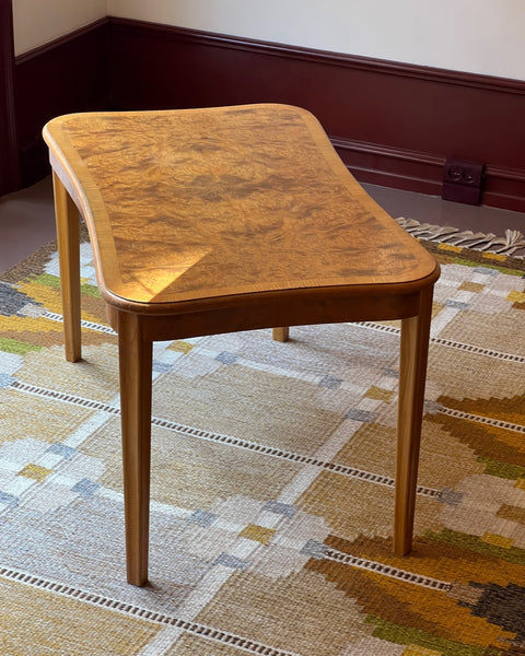 Vintage wooden coffee table with burl details