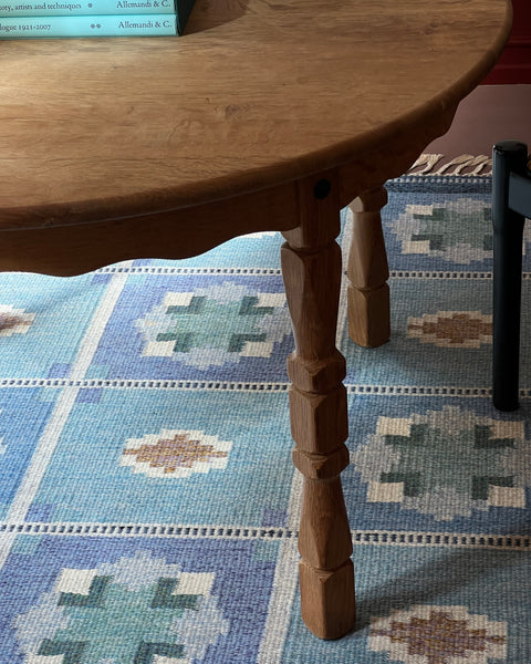 Vintage round wooden dining table with wavy/scalloped details