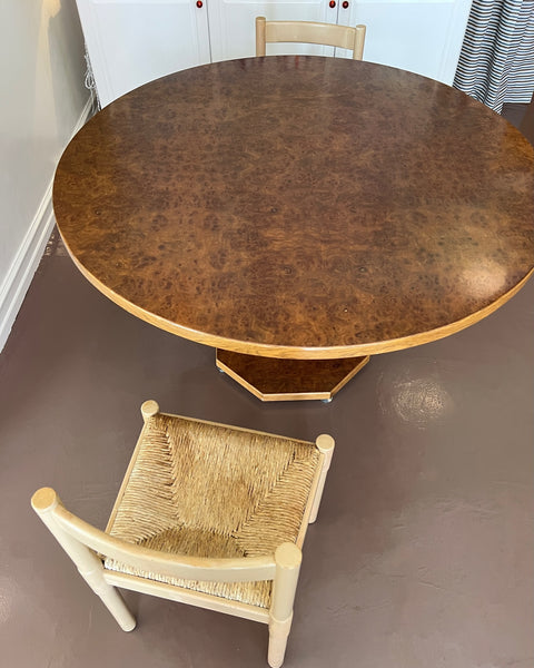 Vintage round wooden dining table with burl details