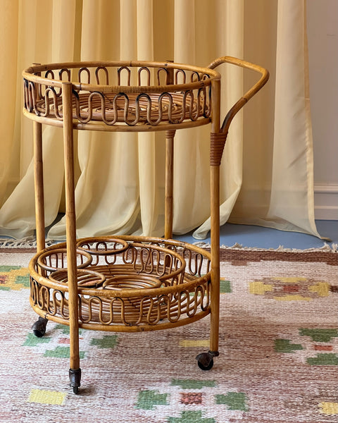 Vintage rattan table with wheels