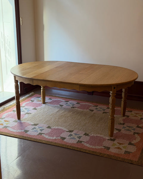 Vintage round wooden dining table with wavy/scalloped details