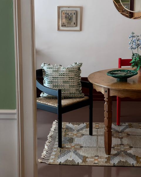 Vintage round wooden dining table with wavy/scalloped details