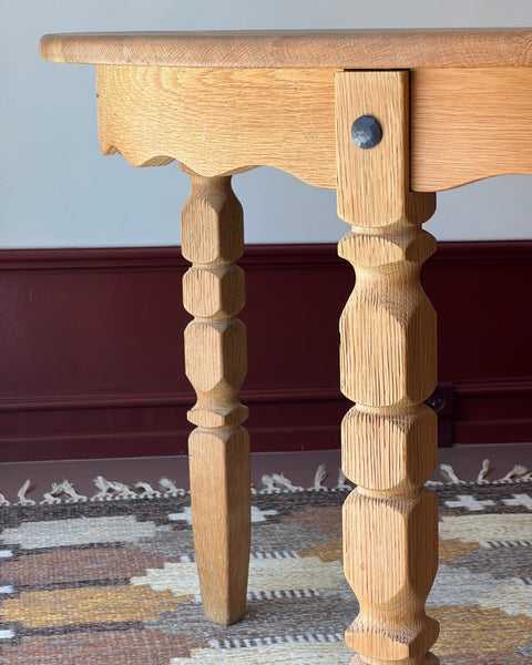 Vintage round wooden dining table with wavy/scalloped details