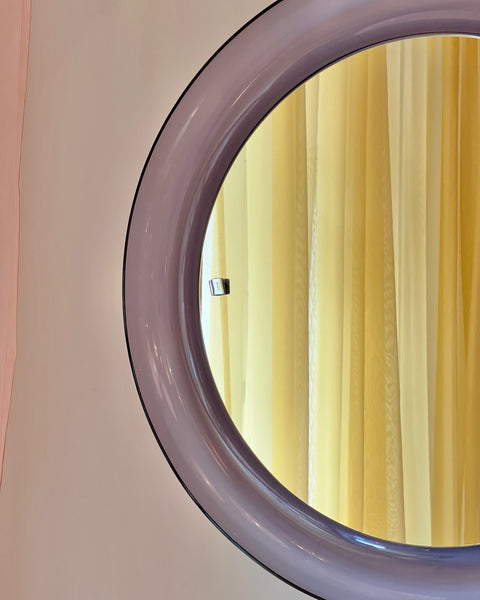Round vintage Italian mirror with purple plastic frame