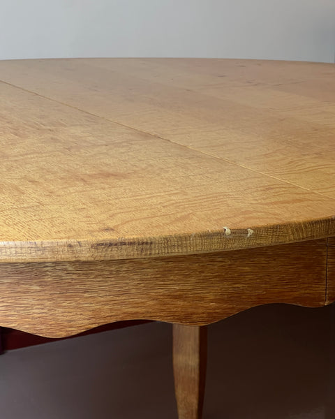 Vintage round wooden dining table with wavy/scalloped details