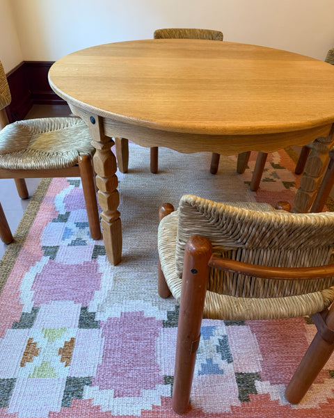 Vintage round wooden dining table with wavy/scalloped details