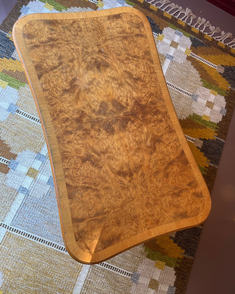 Vintage wooden coffee table with burl details