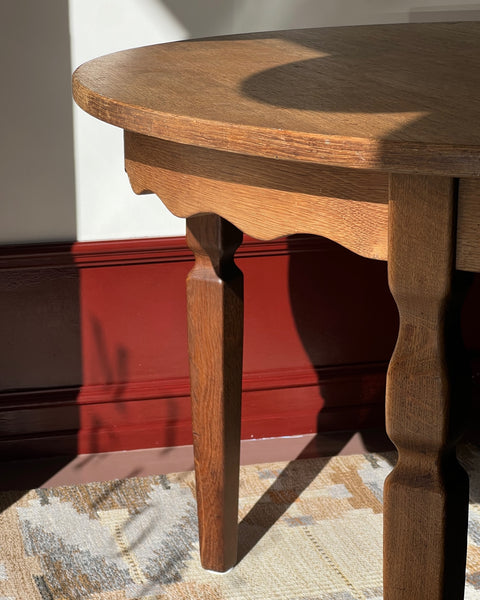 Vintage round wooden dining table with wavy/scalloped details