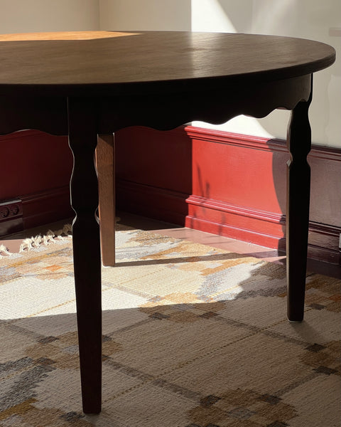 Vintage round wooden dining table with wavy/scalloped details