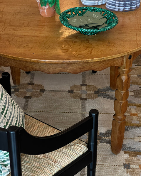 Vintage round wooden dining table with wavy/scalloped details