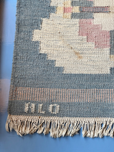 Vintage light blue flat weave rug signed HLO