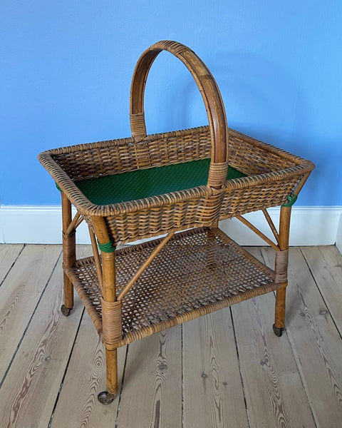 Vintage rattan table with wheels