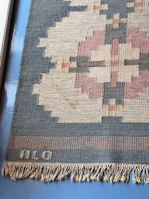 Vintage light blue flat weave rug signed HLO