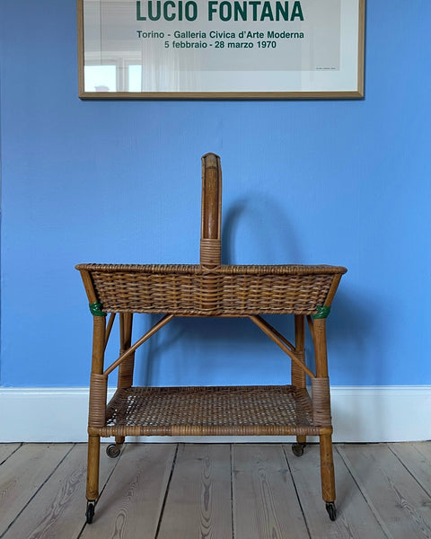 Vintage rattan table with wheels