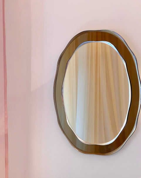 Vintage Italian mirror with wavy golden brown frame