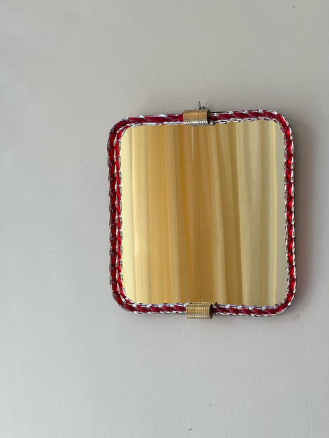 Vintage Italian mirror with red twisted clear glass frame