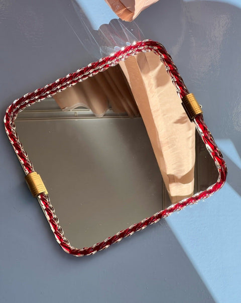 Vintage Italian mirror with red twisted clear glass frame
