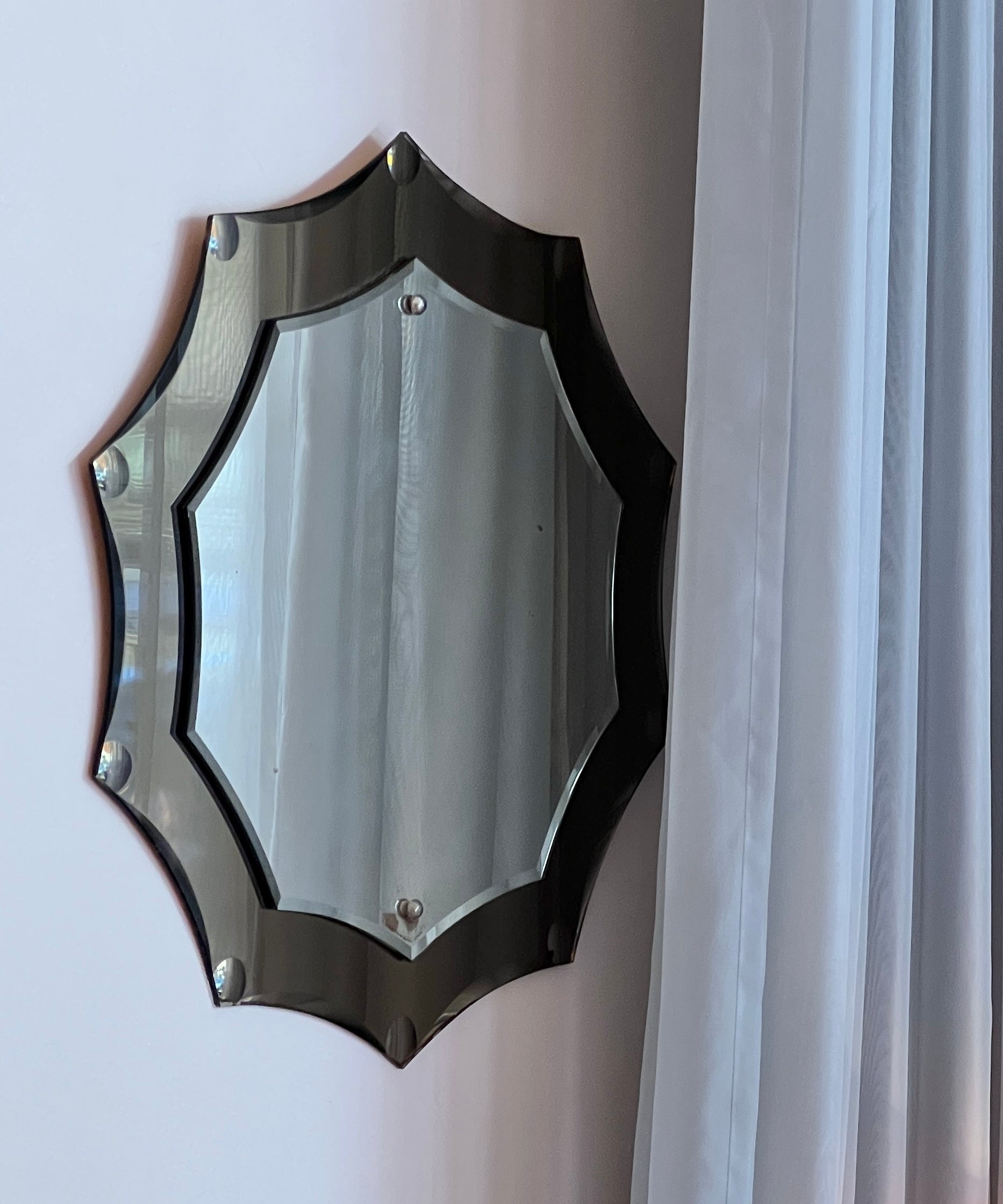 Vintage Italian mirror with golden brown faceted mirror frame