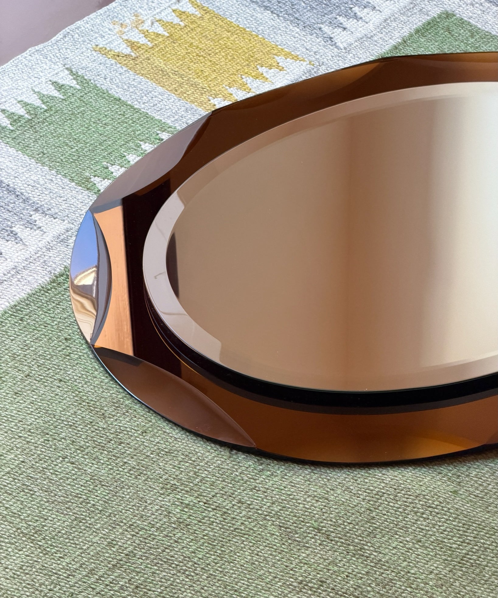 Vintage Italian mirror with golden brown / yellow faceted mirror frame