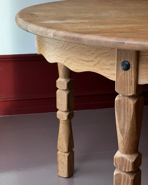 Vintage round wooden dining table with wavy/scalloped details