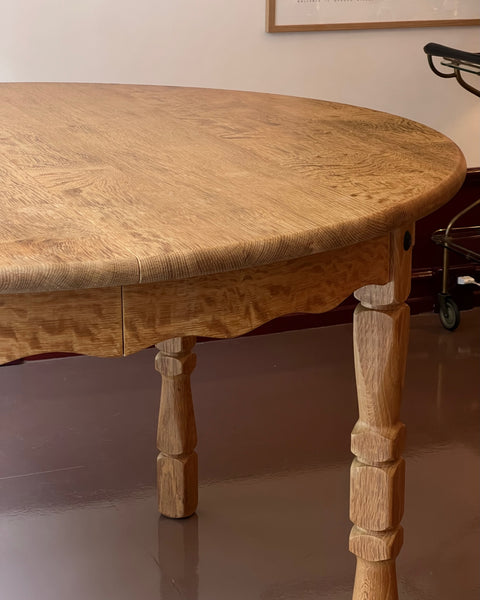 Vintage round wooden dining table with wavy/scalloped details