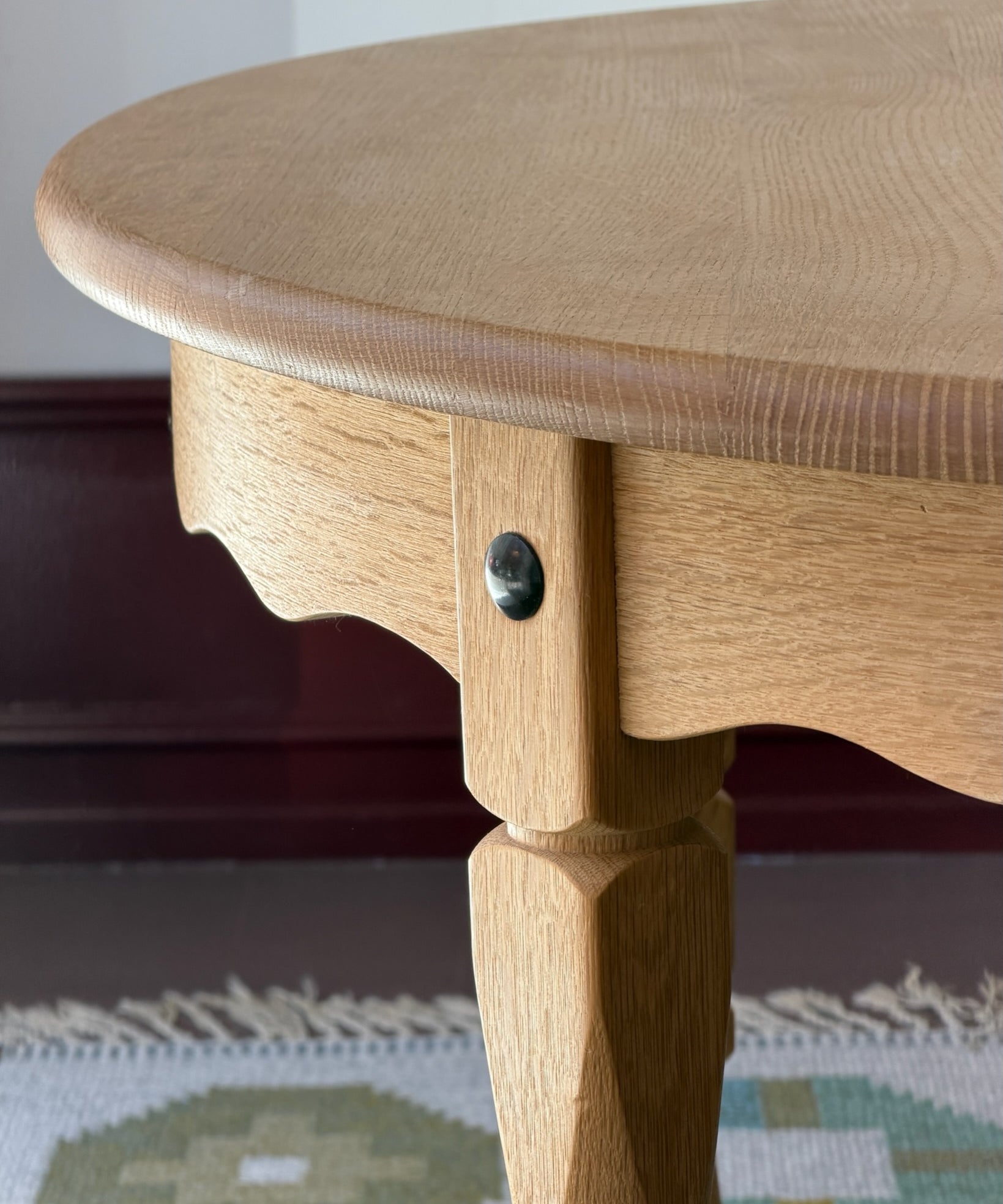 Vintage round wooden dining table with wavy/scalloped details
