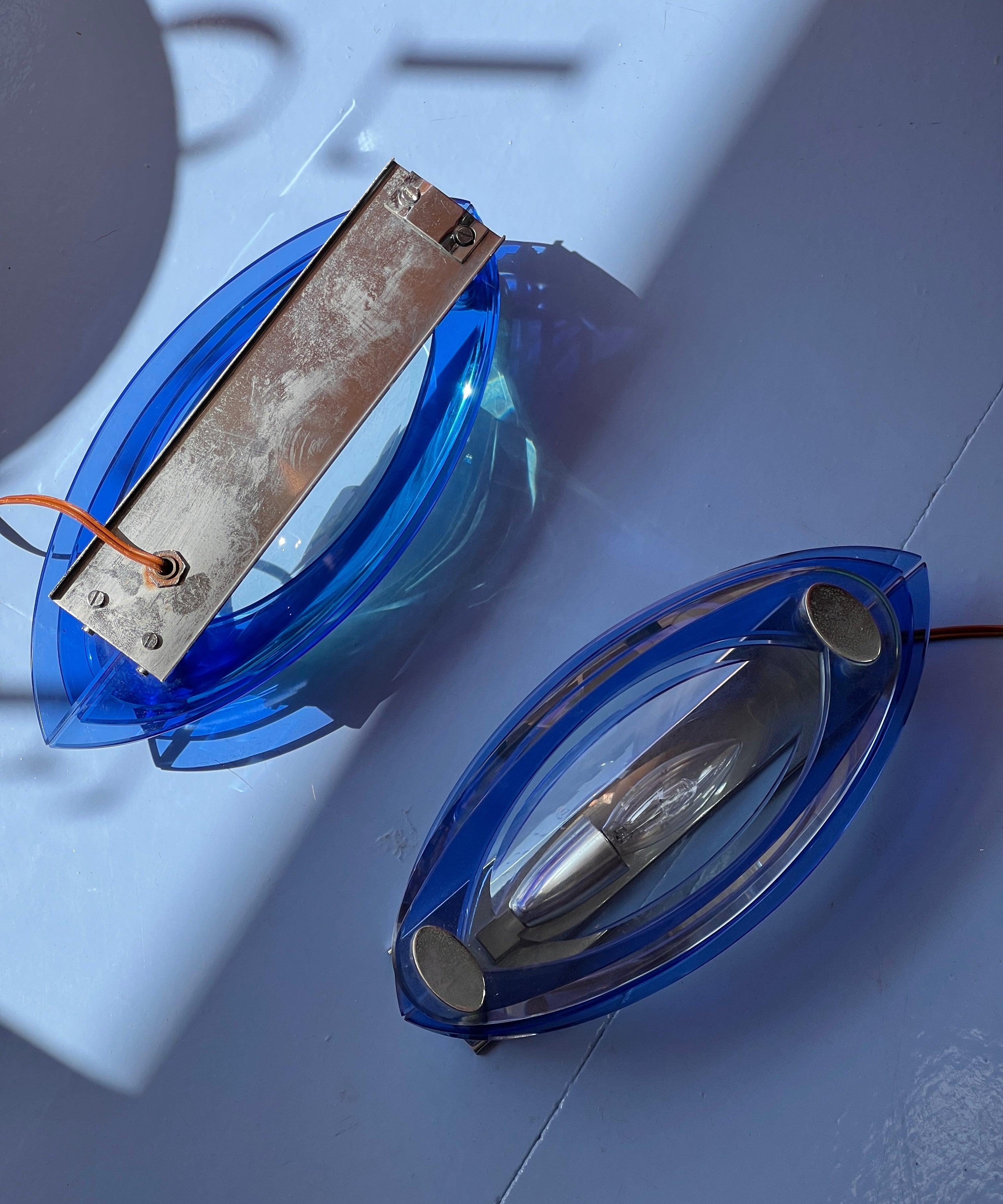 Vintage blue/clear pair of glass wall lamps