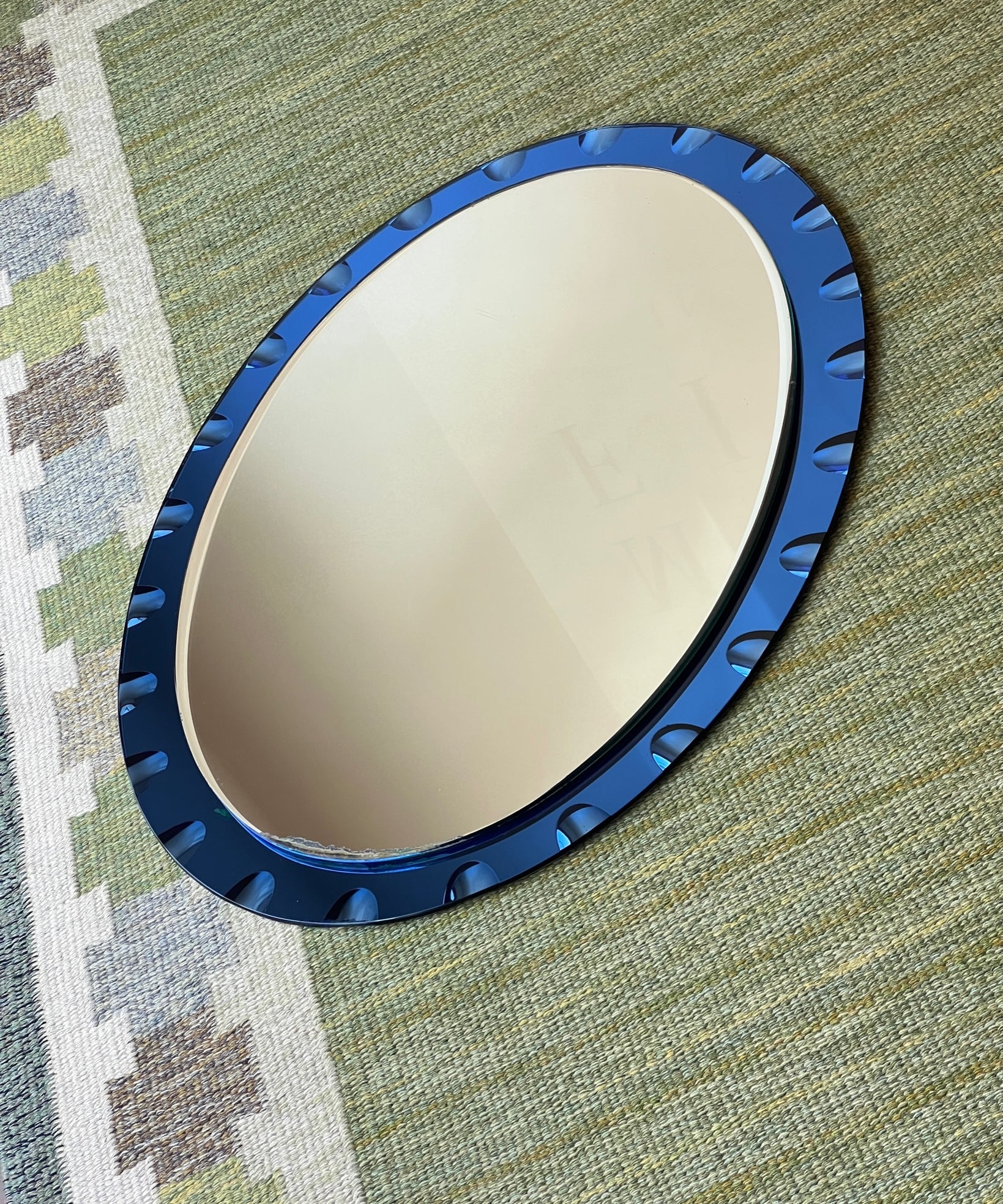 Vintage Italian mirror with blue faceted mirror frame
