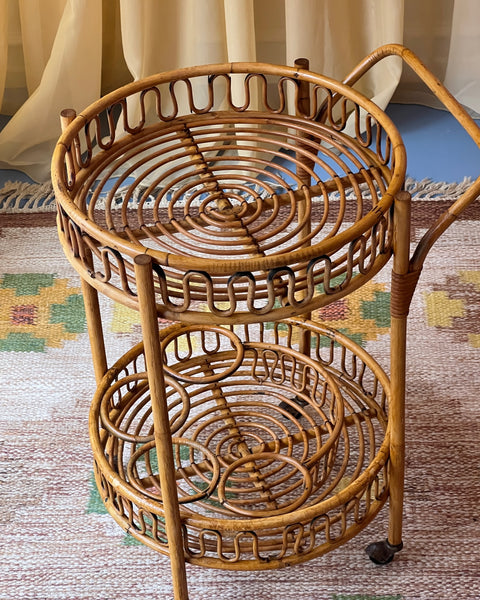 Vintage rattan table with wheels